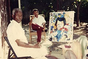 Eugène Malonga en train de peindre