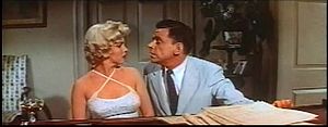 Ewell leans in for kiss in The Seven Year Itch trailer 1.jpg