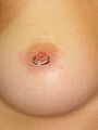 Female nipple piercing.jpg