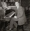 Rachmaninoff seated at Steinway grand piano.jpg