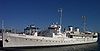 Photograph of the Presidential yacht USS Potomac at dock on a sunny, clear day.
