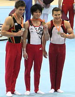 Philipp Boy, à gauche, avec Kohei Uchimura et Jonathan Horton