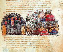 Photographie présentant une page de texte arabe rédigé en rouge, comportant une miniature très colorée représentant le siège de la ville.