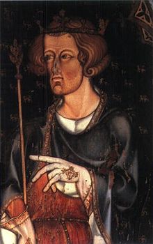 La peinture représente un homme pâle, brun, portant une couronne et tenant un sceptre. Il est habillé d'une robe noire sur une chemise blanche et porte des gants blancs.
