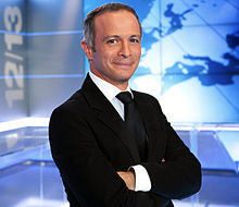 Samuel Étienne sur le plateau de l'édition nationale du 12/13 sur France 3 en septembre 2011.