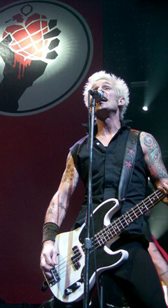 Mike Dirnt at mic in Cardiff.png