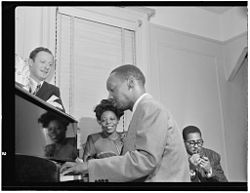 Milt Orent, Mary Lou Williams, Tadd Dameron, and Dizzy Gillespie, Mary Lou Williams' apartment, New York, ca. Aug. 1947 (William P. Gottlieb 15921).jpg
