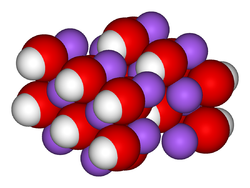 __ Na+     __ HO−Structure du réseau cristallin de l'hydroxyde de sodium.